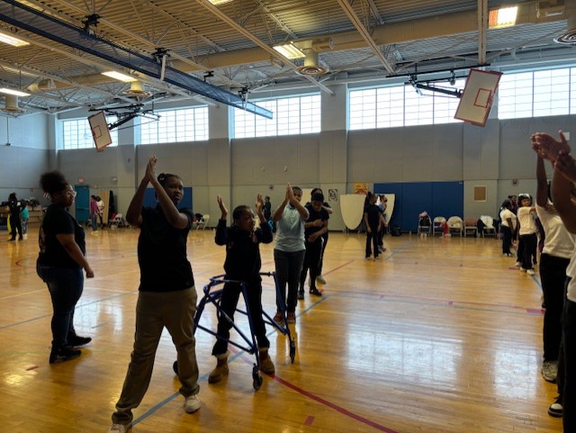  student learning how to cheer